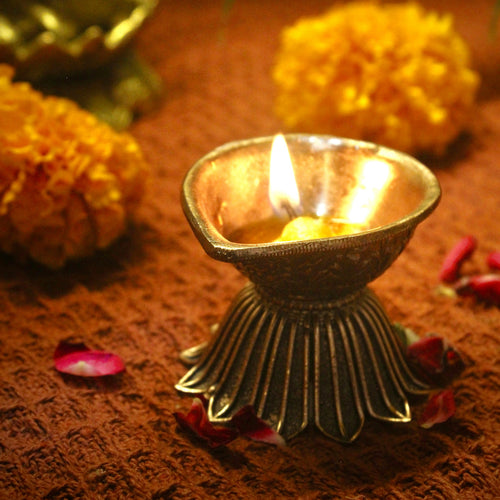 brass diya with lotus base